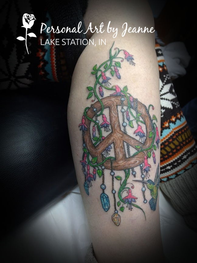peace sign tattoo by Jeanne at Personal Art with dangling jewels and beads